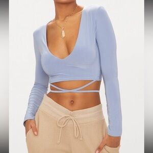 slinky blue cropped v neck long sleeve with wrap around waist tie